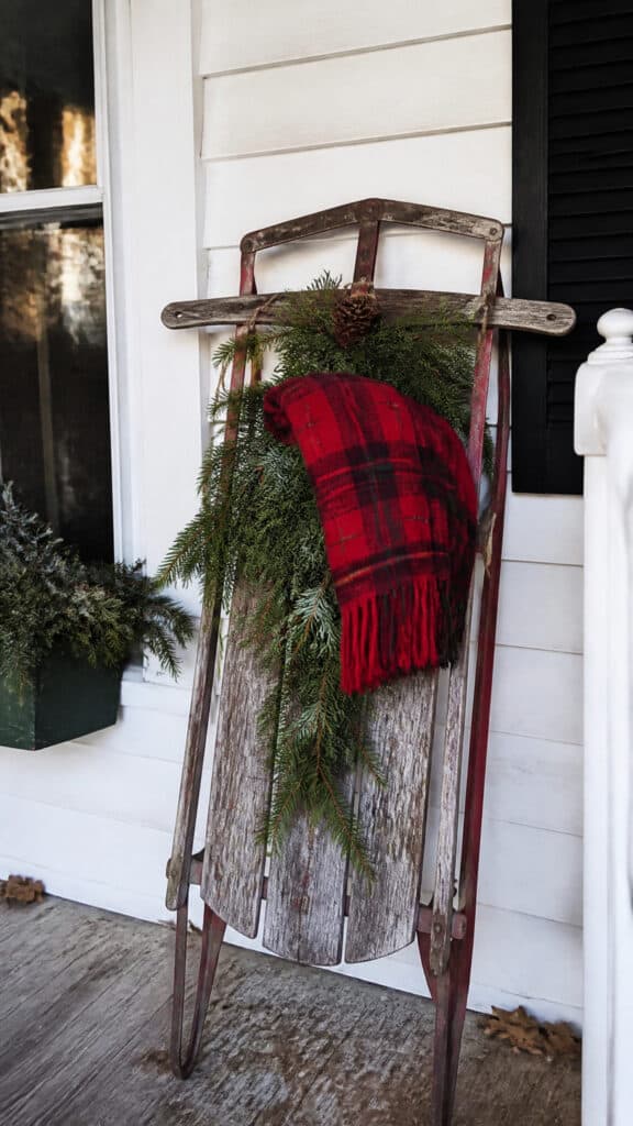 Vintage Sled Leaning Against the Wall
