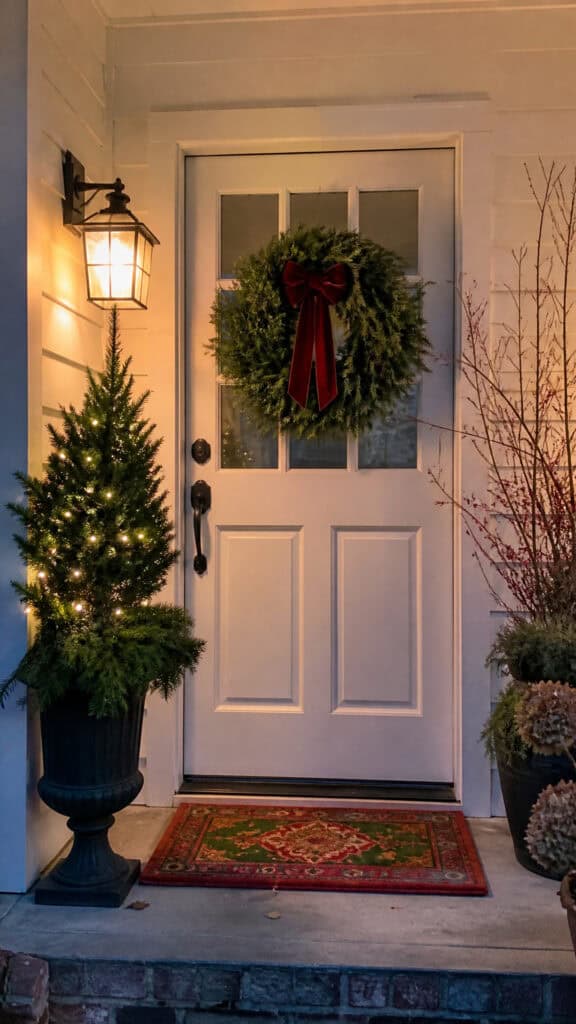 Layer a Festive Doormat with a Cozy Wreath Combo